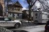 Police vehicles are shown outside the scene of a shooting at a home in Winnipeg on Monday, Nov. 27, 2023. Police in say they have laid charges in the shooting that left four people dead and one injured. THE CANADIAN PRESS/Aaron Vincent Elkaim