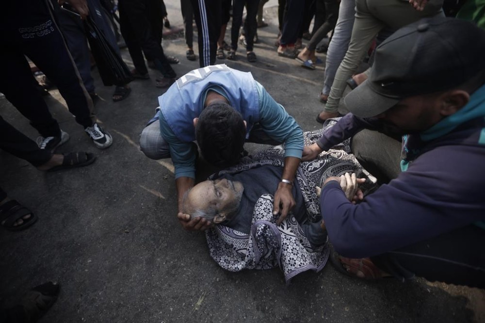 Palestinians evacuate survivors of the Israeli bombing In Khan Younis refugee camp in Gaza Strip on Friday, Dec. 1, 2023. (AP Photo/Mohammed Dahman)