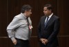 Minister of Crown-Indigenous Relations Gary Anandasangaree speaks with Metis Settlement General Council President Dave Larouche as he waits to appear before the Indigenous and Northern Affairs committee, Thursday, November 30, 2023 in Ottawa. THE CANADIAN PRESS/Adrian Wyld