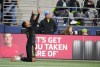 Los Angeles FC forward Denis Bouanga points skyward after scoring against the Seattle Sounders during the first half of an MLS conference semifinal playoff soccer match Sunday, Nov. 26, 2023, in Seattle. (AP Photo/Lindsey Wasson)