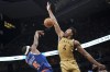 Toronto Raptors forward Scottie Barnes (4) jumps to block a shot by New York Knicks guard Immanuel Quickley (5) during second half NBA basketball action in Toronto on Friday, December 1, 2023. THE CANADIAN PRESS/Arlyn McAdorey