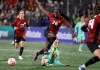 Canada's Simi Awujo avoids a tackle by Australia's Courtney Nevin during first half soccer action at Starlight Stadium in Langford, B.C., on Friday, December 1, 2023. THE CANADIAN PRESS/Chad Hipolito