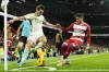 Granada's Carlos Neva, right, challenges for the ball with Real Madrid's Brahim Diaz during the Spanish La Liga soccer match between Real Madrid and Granada at the Santiago Bernabeu stadium in Madrid, Spain, Saturday, Dec. 2, 2023. (AP Photo/Jose Breton)