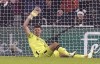Newcastle United goalkeeper Nick Pope signals to the bench after picking up an injury during the English Premier League soccer match between Newcastle United and Manchester United at St. James' Park, Newcastle, England, Saturday, Dec. 2, 2023. (Owen Humphreys/PA via AP)