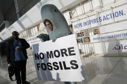 Alice McGown holds a sign reading 