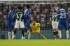 Chelsea's goalkeeper Robert Sanchez saves during the English Premier League soccer match between Chelsea and Brighton and Hove Albion, at Stamford Bridge stadium in London, Sunday, Dec. 3, 2023. (AP Photo/Alastair Grant)