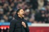 Leverkusen's head coach Xabi Alonso reacts during the German Bundesliga soccer match between Bayer Leverkusen and Borussia Dortmund at the BayArena in Leverkusen, Germany, Sunday, Dec. 3, 2023 (AP Photo/Martin Meissner)