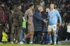 Tottenham's head coach Ange Postecoglou, center right, holds back Manchester City's Erling Haaland, right, arguing with Tottenham players at the end of the English Premier League soccer match between Manchester City and Tottenham Hotspur at Etihad stadium in Manchester, England, Sunday, Dec. 3, 2023. The game ended in a 3-3 draw. (AP Photo/Dave Thompson)