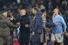 Manchester City's head coach Pep Guardiola, 3rd left, speaks with Tottenham team staff while Manchester City's Erling Haaland, right, argues with Tottenham players, at the end of the English Premier League soccer match between Manchester City and Tottenham Hotspur at Etihad stadium in Manchester, England, Sunday, Dec. 3, 2023. The game ended in a 3-3 draw. (AP Photo/Dave Thompson)