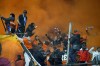 Marseille fans cheer for their team during the French League One soccer match between Olympique de Marseille and Rennes at the Velodrome stadium in Marseille, France, Sunday, Dec. 3, 2023. (AP Photo/Daniel Cole)