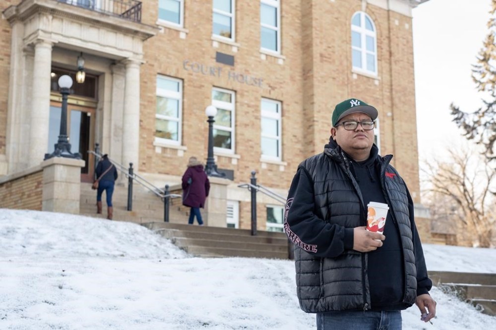 Brett Herman, brother of Braden Herman who was killed in May of 2021, stands for a photograph outside of the Court of King's Bench in Prince Albert, Sask., Monday, Dec. 4, 2023. He was there for during the opening day of the trail of Bernie Herman, a former Saskatchewan Mountie, who has been charged with first-degree murder in the death of Braden Herman. THE CANADIAN PRESS/Liam Richards