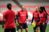 Canada's national women's soccer team captain Christine Sinclair, back left, who is scheduled to play her final international match on Tuesday, laughs during training with Janine Beckie, back right, and Ashley Lawrence, right, in Vancouver, on Monday, Dec. 4, 2023. Sinclair, 40, calls time on her international career Tuesday in her backyard, against Australia, in what will be her 331st appearance for Canada. THE CANADIAN PRESS/Darryl Dyck