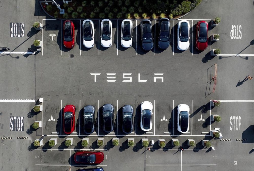 FILE - Tesla vehicles line a parking lot at the company's Fremont, Calif., factory, on Sept. 18, 2023. The conflict against Tesla in Sweden is spreading to neighboring Denmark where transport workers with the country’s largest trade union on Tuesday, Dec. 5, 2023 said it was establishing a sympathy conflict against the Texas-based automaker. (AP Photo/Noah Berger, File)