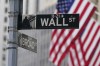 FILE - A street sign is seen in front of the New York Stock Exchange in New York, Tuesday, June 14, 2022. Wall Street headed lower early Tuesday, Dec. 5, 2023, after Moody’s Investor Service downgraded China’s sovereign debt rating as the country’s real estate crisis seeps into its local government and private financing. (AP Photo/Seth Wenig, File)