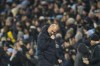 Manchester City's head coach Pep Guardiola reacts after Manchester City's Phil Foden scored his side's second goal during the English Premier League soccer match between Manchester City and Tottenham Hotspur at Etihad stadium in Manchester, England, Sunday, Dec. 3, 2023. (AP Photo/Dave Thompson)