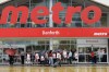 More than a month after 3,700 grocery store workers walked off their jobs at Toronto-area Metro stores in July, they returned to work under a new contract that Unifor called 'historic.' Customers, workers, and security stand outside a Metro grocery store in Toronto on July 29.THE CANADIAN PRESS/Cole Burston