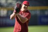 FILE - Los Angeles Angels center fielder Mike Trout warms up before a baseball game against the Colorado Rockies, Saturday, June 24, 2023, in Denver. The Angels will not trade three-time AL MVP Mike Trout. General manager Perry Minasian confirmed it at MLB’s winter meetings. (AP Photo/David Zalubowski, File)
