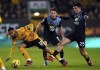 Wolverhampton Wanderers' Matheus Cunha, left, and Burnley's Zeki Amdouni battle for the ball on during the English Premier League soccer match between Wolverhampton Wanderers and Burnley at Molineux Stadium, Wolverhampton, England, Tuesday, Dec. 5, 2023. (Mike Egerton/PA via AP)
