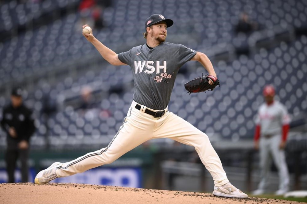FILE - Washington Nationals starting pitcher Erick Fedde throws during the first baseball game of the team's doubleheader against the Philadelphia Phillies, Sept. 30, 2022, in Washington. Fedde is returning to the majors with the Chicago White Sox after spending last season in South Korea. The right-hander has agreed to a $15 million, two-year contract with Chicago, according to a person familiar with the deal who spoke to The Associated Press on condition of anonymity because the move was pending a physical. (AP Photo/Nick Wass, File)