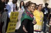 Danielle Frank, center, participates in a demonstration with her grandmother, Kathryn Diane Horinek at the COP28 U.N. Climate Summit, Tuesday, Dec. 5, 2023, in Dubai, United Arab Emirates. (AP Photo/Peter Dejong)
