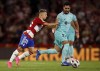 FILE - Granada's Bryan Zaragoza pushes Barcelona's Ilkay Gundogan during a Spanish La Liga soccer match between Granada and Barcelona at Los Carmanes Stadium in Granada, Spain, on Oct. 8, 2023. Bayern Munich is signing Spain winger Bryan Zaragoza from struggling La Liga team Granada, with the deal set to go through in July. The German champion said Wednesday Dec. 6, 2023 that the 22-year-old Zaragoza would sign a five-year contract running through to 2029 when he joins Bayern at the end of the season. (AP Photo/Fermin Rodriguez, File)
