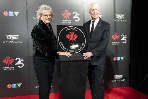Degrassi creators Linda Schuyler, left, and Stephen Stohn pose with their star at Canada's Walk of Fame's 25th Anniversary gala in Toronto, on Saturday, Dec. 2, 2023. THE CANADIAN PRESS/Arlyn McAdorey