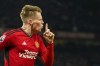 Manchester United's Scott McTominay celebrates after scoring his side's second goal during the English Premier League soccer match between Manchester United and Chelsea at Old Trafford stadium in Manchester, England, Wednesday, Dec. 6, 2023. (AP Photo/Dave Thompson)