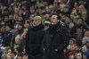 Manchester City's head coach Pep Guardiola, left, and Aston Villa's head coach Unai Emery follow the game of the English Premier League soccer match between Aston Villa and Manchester City at Villa Park in Birmingham, England, Wednesday, Dec. 6, 2023. (AP Photo/Rui Vieira)