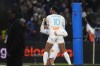 Marseille's Pierre-Emerick Aubameyang, top, celebrates with Vitor Oliveira Vitinha after scoring his side's third goal during the French League One soccer match between Olympique de Marseille and Lyon at the Velodrome Stadium in Marseille, France, Wednesday, Dec. 6, 2023. (AP Photo/Daniel Cole)