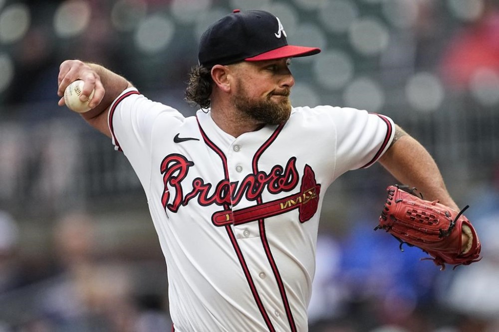 FILE -Atlanta Braves relief pitcher Kirby Yates works in the eighth inning of the team's baseball game against the Miami Marlins on Thursday, April 27, 2023, in Atlanta. The Texas Rangers signed veteran reliever Kirby Yates to a $4.5 million, one-year contract Wednesday, Dec. 6, 2023 to bolster the bullpen of the World Series champs.(AP Photo/John Bazemore, File)