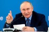 FILE - Russian President Vladimir Putin gestures while speaking at an exhibition at the Mashuk educational center in Pyatigorsk, Stavropol region, Russia, on Dec. 5, 2023. Russian lawmakers on Thursday, Dec. 7 set the date of the 2024 presidential election for March 17, moving Vladimir Putin closer to a fifth term in office. (Sergei Karpukhin, Sputnik, Kremlin Pool Photo via AP, File)
