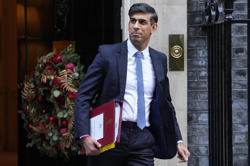 Britain's Prime Minister Rishi Sunak leaves 10 Downing Street to attend the weekly session of Prime Ministers Questions in Parliament in London, Wednesday, Dec. 6, 2023. (AP Photo/Kirsty Wigglesworth)