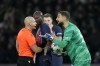 PSG's goalkeeper Gianluigi Donnarumma speaks to Referee Szymon Marciniak during the Champions League group F soccer match between Paris Saint-Germain and Newcastle United FC at the Parc des Princes in Paris, Tuesday, Nov. 28, 2023. (AP Photo/Christophe Ena)