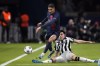Newcastle's Tino Livramento tries to tackle PSG's Achraf Hakimi during the Champions League group F soccer match between Paris Saint-Germain and Newcastle United FC at the Parc des Princes in Paris, Tuesday, Nov. 28, 2023. (AP Photo/Christophe Ena)