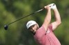 Jon Rahm from Spain plays his second shot on the second hole hole during the final round of the DP World Tour Championship golf tournament, in Dubai, United Arab Emirates, Sunday, Nov. 19, 2023. (AP Photo/Kamran Jebreili)