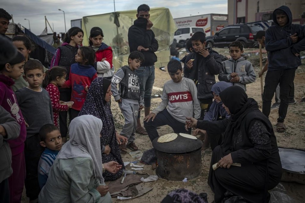 Palestinians displaced by the Israeli ground offensive on the Gaza Strip set up a tent camp in the Muwasi area Thursday, Dec. 7, 2023. AP Photo/Fatima Shbair)