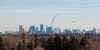 MIKE DEAL / WINNIPEG FREE PRESS 
A plane approaches Winnipeg's airport over the city's skyline.