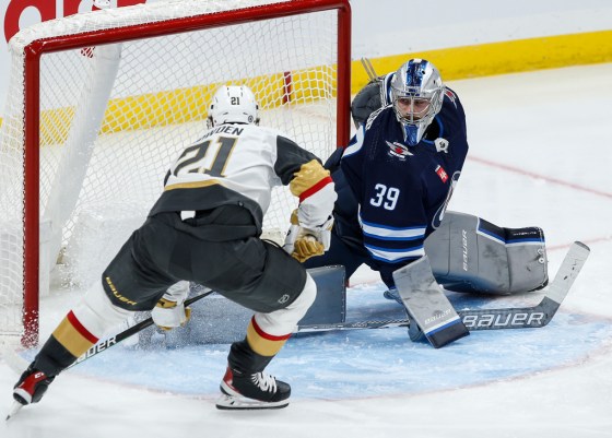 Vegas Golden Knights' Brett Howden (21) scores on Winnipeg Jets goaltender Laurent Brossoit (39) during second period NHL action in Winnipeg on Oct. 19. (John Woods / The Canadian Press)