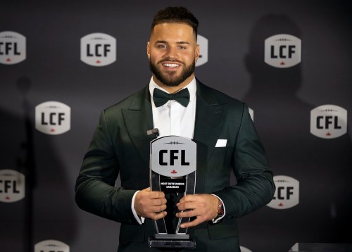 Winnipeg Blue Bombers' Brady Oliveira with his award for Most Outstanding Canadian at the 2023 Canadian Football League (CFL) Awards in Niagara Falls, Ont. Thursday, November 16, 2023. Players and league personnel are being honoured ahead of 110th Grey Cup that takes place in Hamilton, Ont. between Winnipeg and Montreal on Sunday, November 19. THE CANADIAN PRESS/Tara Walton
