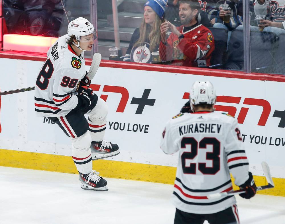 JOHN WOODS / THE CANADIAN PRESS

Chicago rookie Connor Bedard (left) and teammates Philipp Kurashev celebrate Bedard’s 11th goal of the season.