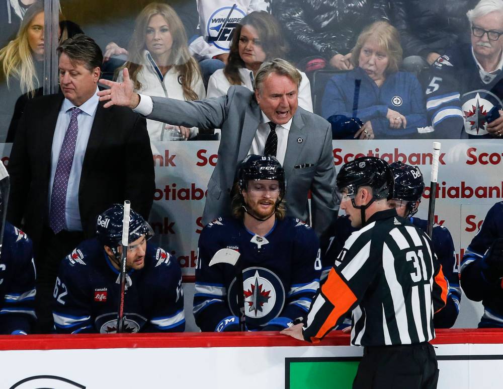 JOHN WOODS / THE CANADIAN PRESS

Jets head coach Rick Bowness disputes a call with a referee during the first period Saturday afternoon.