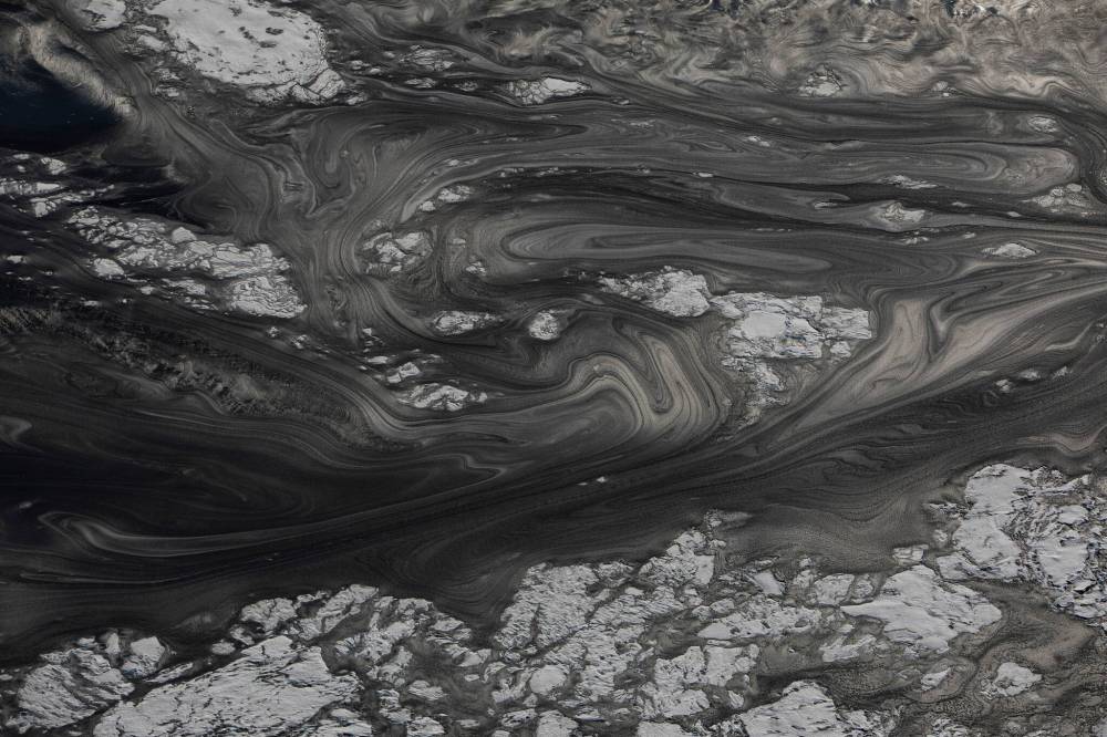 AMBER BRACKEN FOR THE NARWHAL 
                                Mature tailings ponds are ripe with the glossy sheen of oil.