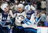 David Zalubowski / The Associated Press
                                Winnipeg Jets Josh Morrissey (left), Nino Niederreiter and Connor Hellebuyck congratulate each other following Thursday night’s victory over the Colorado Avalanche.