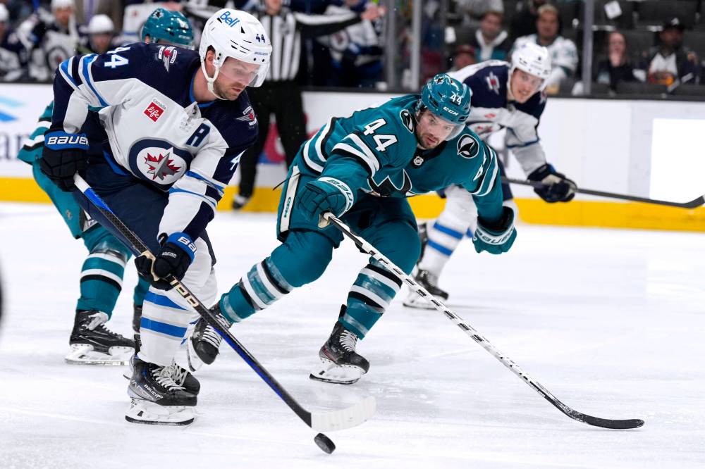 Tony Avelar / The Associated Press
Winnipeg Jets defenceman Josh Morrissey carries the puck up ice past San Jose Sharks defenceman Marc-Edouard Vlasic during the second period Tuesday, in San Jose.