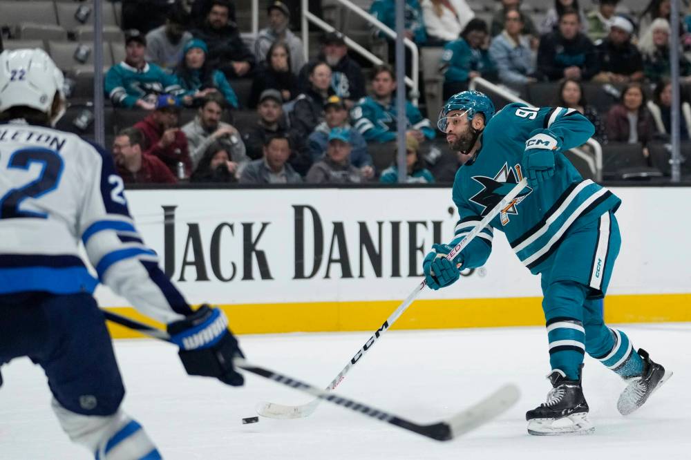 Godofredo A. Vásquez / The Associated Press
San Jose Sharks right winger Justin Bailey scores a goal against the Winnipeg Jets during the first period Tuesday, in San Jose.