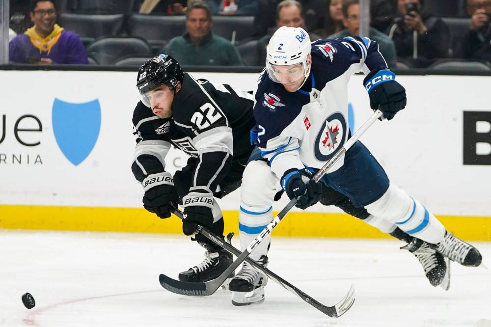 Ryan Sun / The Associated Press
Los Angeles Kings left wing Kevin Fiala and Winnipeg Jets defenceman Dylan DeMelo battle for the puck during the second period.