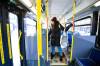 MIKAELA MACKENZIE / WINNIPEG FREE PRESS
                                Eva Wasney takes the bus with bags of groceries in Winnipeg.