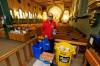 “It’s a good example to show the kids how to help other people,” says Johnny Ortizo, with donations for a food drive for Harvest Manitoba at St. Edward the Confessor Church. (Mike Deal / Winnipeg Free Press)