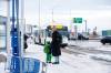 MIKAELA MACKENZIE / WINNIPEG FREE PRESS
                                Venera Sorkina and her son, Ivan, wait for the second bus on their way back home from Mosaic’s English language class on Monday, Dec. 11, 2023. At this bus stop in the past they have had to go and warm up in a nearby McDonaldճ when multiple buses have been late or cancelled. For Malak story. Winnipeg Free Press 2023