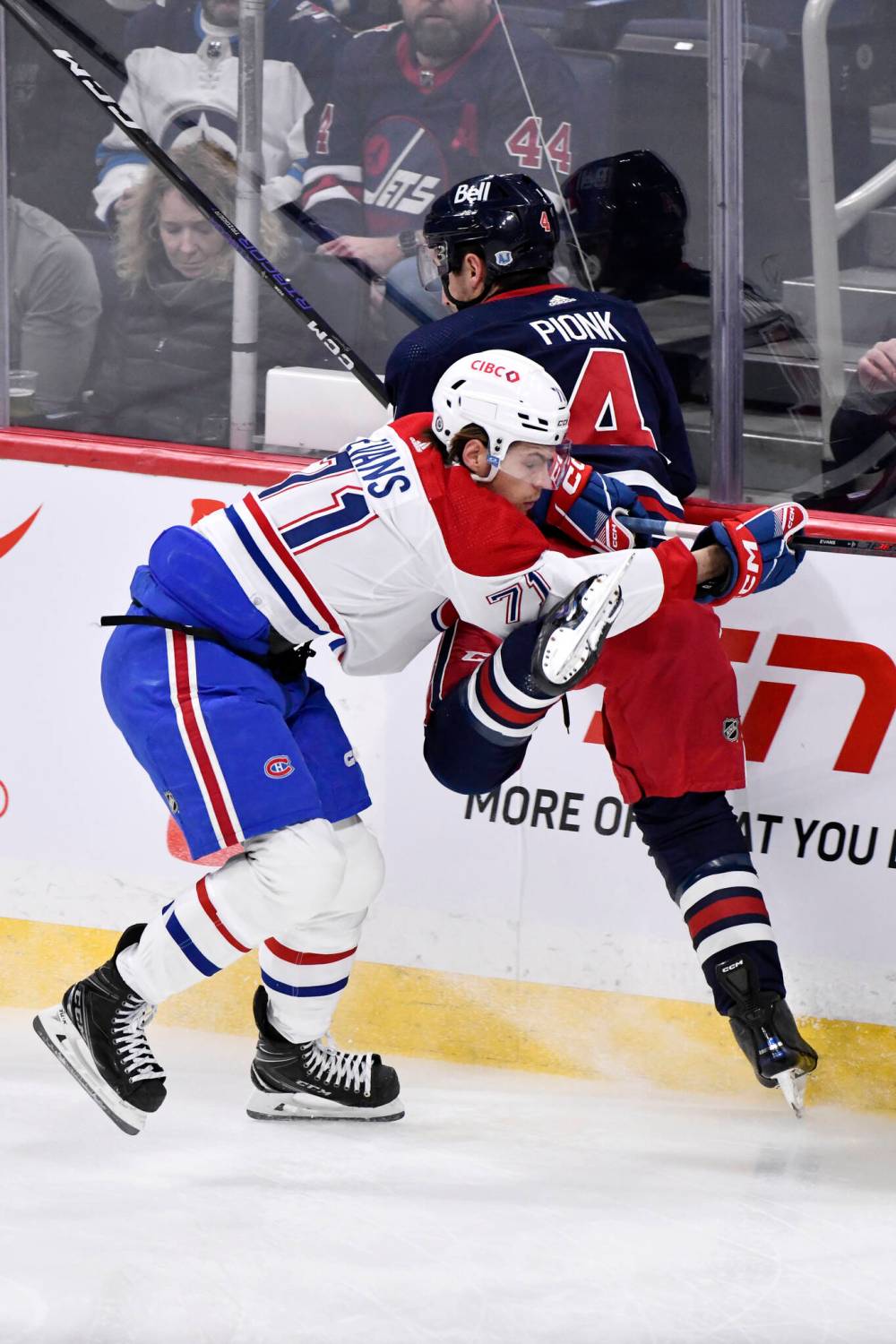 THE CANADIAN PRESS/Fred Greenslade
Montreal Canadiens’ Jake Evans checks Winnipeg Jets’ Neal Pionk during the first period.